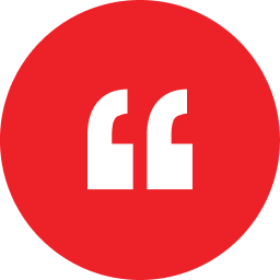 Red circle with two white quotation marks inside.