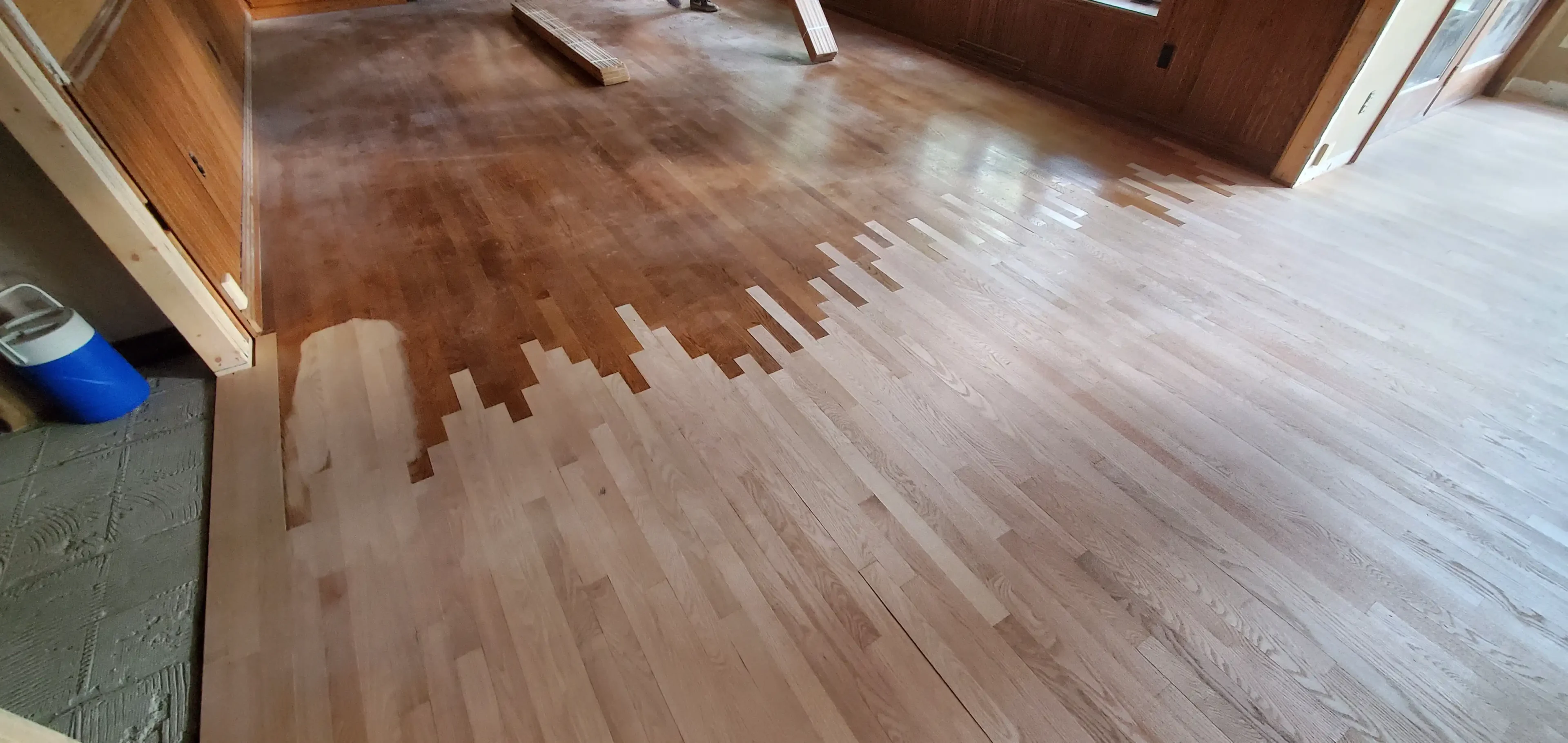 67eef971b4685_20221011_170325 A wooden floor with some brown spots on it
